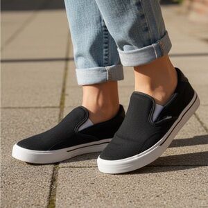 Adidas Slip ons, Women size 6 US, Black/White